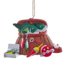 a christmas ornament that is hanging from a rope with toys in the basket