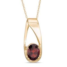 On-trend and oh-so attractive, this intriguing gemstone pendant is a gorgeous fashion find. Crafted in warm 10K gold, this unique design features an 8.0 x 6.0mm oval-shaped regal red garnet at the base of an oblong offset slip-bail style. Buffed to a brilliant luster, this dainty birthday-ready or anytime pendant suspends along an 18.0-inch rope chain that secures with a spring-ring clasp. Elegant Oval Garnet Necklace, Elegant Jewelry With Oval Cabochon Garnet, Elegant Garnet Oval Cabochon Jewelry, Formal Oval Garnet Pendant Jewelry, Elegant Teardrop Garnet Pendant Jewelry, Elegant Garnet Teardrop Pendant Jewelry, Elegant Teardrop Pendant Garnet Jewelry, Formal Oval Garnet Jewelry, Garnet Pendant