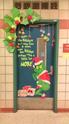 the grinch door decoration is decorated with christmas decorations