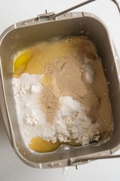 a pan filled with flour and eggs on top of a table