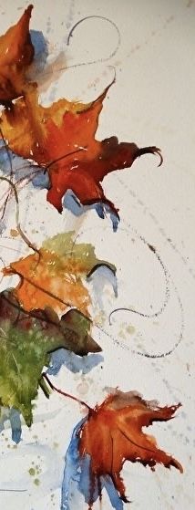 three autumn leaves on a white surface with watercolor paint swirls around the edges