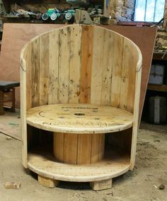 a wooden bench sitting in the middle of a room