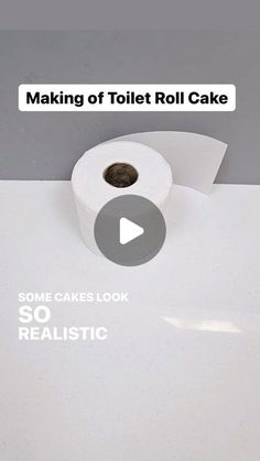 a roll of toilet paper sitting on top of a white counter with the words making of toilet roll cake