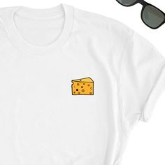 We have express delivery for our shirts! 📦⚡.  From cart to door in just 2-3 days, only for 3.5 USD extra.  You can find the express delivery option in the cart. Cheese Shirt, Cute Cheese Tee Shirt, Cheese Lover Tee Top, Cute Cheese T-Shirt, Cheese Gift Shirt, Cheese Lover Friend UNISEX Tee Shirt Friends will love it! This t-shirt feels soft and lightweight, with the right amount of stretch. It's comfortable and flattering for both men and women.  * 100% cotton (heather colors contain polyester) White Graphic Print Shirt As Gift, White Graphic Print Shirt For Gift, White Crew Neck Shirt As Gift, White Crew Neck Shirt As A Gift, White Tops With Funny Print For Gift, White Graphic Tee As A Gift, Crew Neck Shirt With Screen Print As Gift, White Crew Neck Shirt With Funny Print, Cheese Gifts