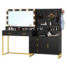 a black vanity with lights and mirror on it