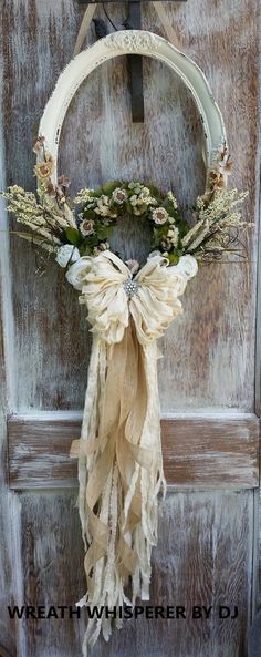 an old door with a wreath hanging on it