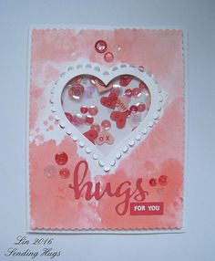 a card with buttons in the shape of a heart and words hugs for you on it