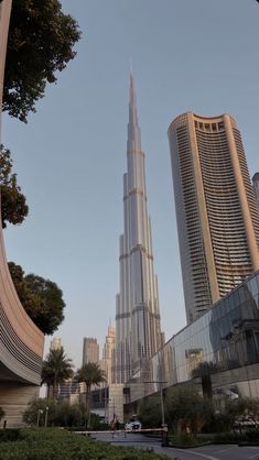 the burj building is surrounded by other tall buildings