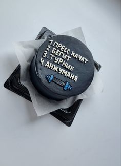 a cake with writing on it sitting on top of napkins