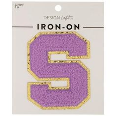 the iron - on number 5 is shown in purple and gold with glitter effect,