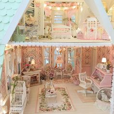 a doll house with furniture and accessories inside