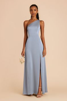 This matte satin version of our fan-favorite one-shoulder gown is the pinnacle of sleek and sexy. Available in Dusty Blue. Our best-selling Kira dress is sleeker and sexier than ever in matte satin. | Dusty Blue Bridesmaid Dress Matte Satin Size 1X | Birdy Grey Kira French Blue Bridesmaid Dress, Dark Teal Bridesmaid Dresses, Wisteria Bridesmaid Dresses, Mauve Bridesmaid, Teal Bridesmaid Dresses, Lilac Bridesmaid Dresses, Dusty Blue Bridesmaid Dresses, Birdy Grey, Blue Bridesmaid Dress