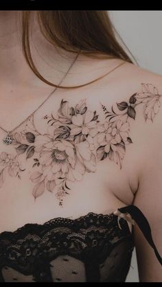 a woman's chest with flowers on it