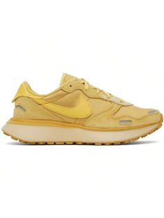 Nike 
Gold Phoenix Waffle Sneakers 
Low-top paneled suede and mesh sneakers in gold tone. Reflective trim throughout. 
. Lace-up closure 
. Swoosh embroidered at padded tongue 
. Padded collar 
. Swoosh appliqué at sides 
. Logo printed at heel tab 
. Mesh lining 
. Treaded rubber sole 
Please note that this item may be shipped only within North America. 
Supplier color: Wheat gold/Saturn 
Upper: leather, textile. Sole: rubber. 
Made in Indonesia. 
241011F128070 
Gold Phoenix Waffle Sneakers def Yellow Perforated Sneakers For Streetwear, Yellow Sneakers With Perforations And Round Toe, Yellow Sporty Sneakers With Perforations, Sporty Yellow Sneakers With Perforations, Jogging Sneakers With Perforations And Round Toe, Round Toe Sneakers With Perforations For Errands, Yellow Sneakers With Rubber Sole For Errands, Jogging Sneakers With Rubber Waffle Outsoles, Leather Running Shoes For Spring