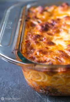 a casserole dish with cheese and meat in it