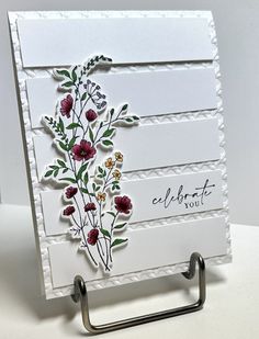 a close up of a card with flowers on it