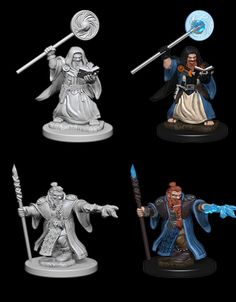 four wizard figurines are shown on a black background