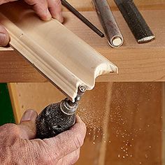 a man is working with woodworking tools and sanding the edges of a piece of plywood