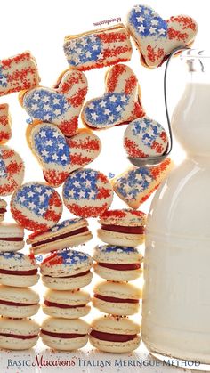 red, white and blue cookies next to a jug of milk with stars on them