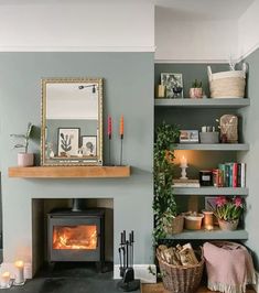 a living room filled with furniture and a fire place