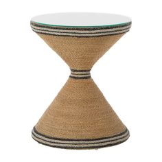 a small table with a glass top and jute material on the bottom, sitting in front of a white background