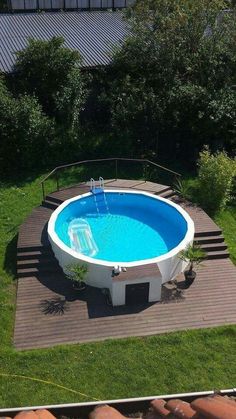 an above ground swimming pool in a backyard