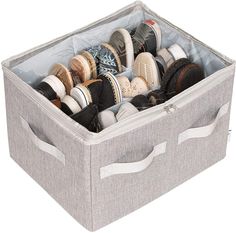 a large gray storage box filled with different types of shoes