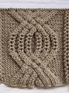 a close up of a knitted object on a table