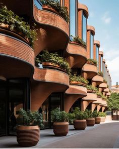 a building with many planters on the side of it's sides and windows