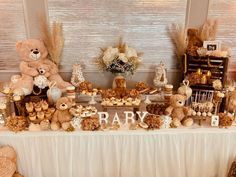 a table with teddy bears and desserts on it