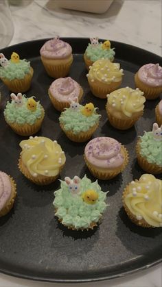 there are many cupcakes that have been decorated in pastel colors and designs