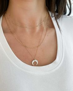 A lustrous mother of pearl in a crescent horn shape takes center stage on this unique necklace. Please note that this item cannot be shipped internationally. Layering Jewelry With Cable Chain, White 14k Gold Jewelry With Adjustable Chain, White 14k Gold Diamond Necklace With Clavicle Chain, White Diamond Necklace With 14k Gold Clavicle Chain, 14k Gold White Diamond Necklace With Clavicle Chain, Everyday Diamond Chain Necklace, 14k Gold Jewelry With Delicate Chain And Round Cut, Everyday Round Diamond Chain Necklace, Everyday White Diamond Necklace In 14k Gold