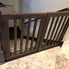 a baby gate in the corner of a room