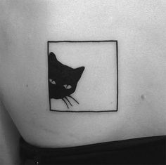 a black and white photo of a cat on the side of a woman's stomach