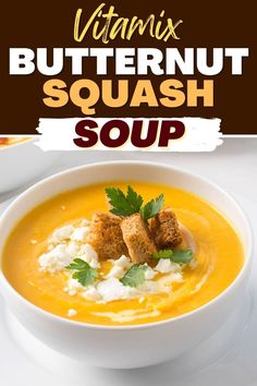 a bowl of butternut squash soup with croutons and parsley