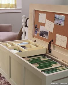 an open drawer with some papers in it