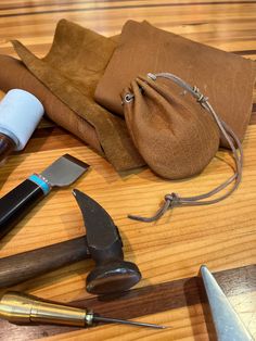 various tools are laid out on a wooden table