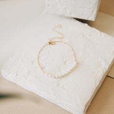 td {border: 1px solid #ccc;}br {mso-data-placement:same-cell;} For the ultra-chic girl with a love of pearls, the modern Pearl Bead Bracelet is just the thing for you! A delicate string of irregular shaped pearls is threaded through a fine chain, to hang from your wrist in delicate, yet oppulent manner. • Material: High Quality Solid 925 Sterling Silver • Finish: Sterling Silver ∙ 18K Gold • Chain length: adjustable from 6 to 8 INCHES Pearl Bead Bracelet, 18k Gold Chain, The Thing, Bead Bracelet, Manners, Solid 925 Sterling Silver, Pearl Beads, Ring Necklace, A Love