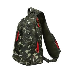 the back pack is designed to look like camouflage camo print with red zippers