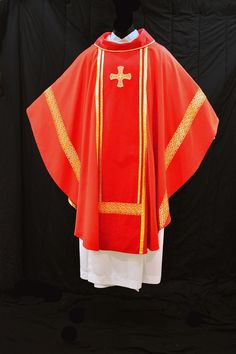 Custom made just for you. Brilliant red wool chasuble, with cotton velvet orphey, velvet cowl, metallic brocade and galloon accents. Single embroidered gold cross at upper chest. Lined with silk habotai (china silk). Stole is included. This chasuble may be made in different widths, due to the additional front seams.  The standard cowl is optional; you may choose a plain rounded neckline or a wrapped cowl instead. Base fabric is also available in ivory. There are many galloon options to choose from. All my items are custom sewn for the wearer. Please add these measurements to the comments: 1. Head circumference 2. Height of wearer 3. Shoulder width Allow 4-6 weeks for fabric sourcing and manufacturing. Shipping time is additional. Express orders may be considered; please contact me to inqui Red Embroidered Chasuble For Church, Traditional Red Chasuble For Ceremonial Use, Red Wool, Gold Cross, Saint Paul, Cotton Velvet, Etsy Listing, Custom Made, Velvet