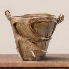 a wooden bowl sitting on top of a table