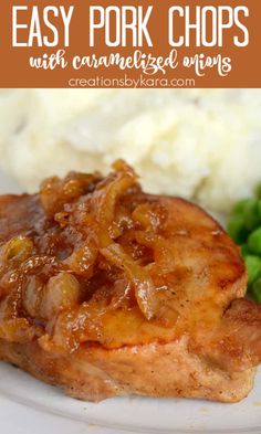 pork chops with caramelized onions and mashed potatoes on a white plate