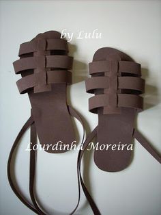 a pair of sandals made out of brown paper