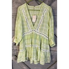 Add A Touch Of Bohemian Style To Your Collection With This Nwt Free People Blouse. The Mint Green Top Features A V-Neckline And Pullover Closure, With 3/4 Balloon Sleeves And Crochet And Embroidered Accents For A Unique Touch. Made Of Comfortable Cotton Material, This Relaxed Fit Tunic Is Perfect For Any Occasion. The Blouse Comes In Size L And Is Ideal For Those Who Love Designer, Bohemian, And Peasant Themes. Grab This Top And Pair It With Shorts Or Jeans To Complete Your Look. We Attempt To D Spring V-neck Blouse With Chikankari Embroidery, Cotton V-neck Blouse With Embroidered Hem, Summer V-neck Blouse With Chikankari Embroidery, Spring V-neck Blouse With Lace Work, Bohemian V-neck Blouse With Embroidered Hem, Green Bohemian V-neck Blouse, Vacation V-neck Blouse With Embroidered Hem, Summer V-neck Tunic With Chikankari Embroidery, V-neck Blouse With Embroidered Hem For Vacation