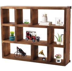 a wooden shelf filled with toy cars and figurines