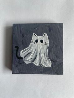 a drawing of an octopus with a cat's face drawn on the front and side