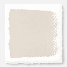 a white paint swatch on a gray background