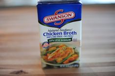 a can of swanson chicken broth on a wooden table