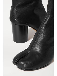 MAISON MARGIELA Tabi split-toe leather ankle boots | NET-A-PORTER Designer Boots With Pointed Toe And Rubber Heel Cap, Designer Boots With Sculpted Heel And Round Toe, Designer Ankle Boots With Sculpted Heel, Designer Heeled Boots With Almond Toe And Leather Sole, Designer Ankle Boots With Leather Sole, Designer Ankle Heeled Boots With Leather Sole, Designer Ankle-high Boots With Sculpted Heel, Designer Open Toe Boots For Formal Occasions, Designer Heeled Boots With Sculpted Heel And Round Toe