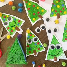 paper plate christmas trees with googly eyes and pom - poms on them